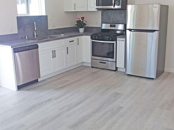 Kitchen with hanging light for dining table