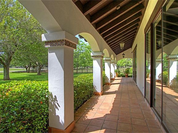 The beautiful covered porch expands the entire first floor on the front elevation of this gorgeous home.