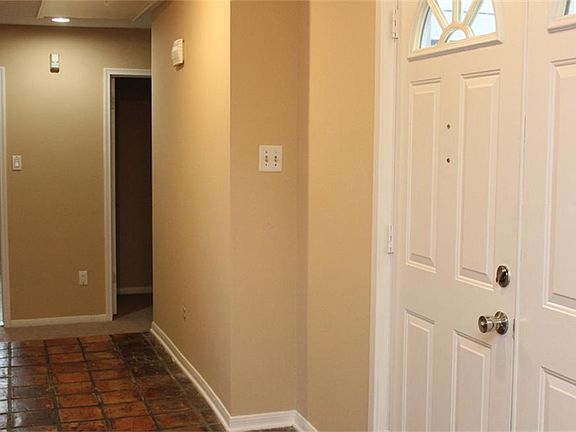 Entrance with view to the right of foyer...leads to bedrooms. All fresh paint in neutral tones.