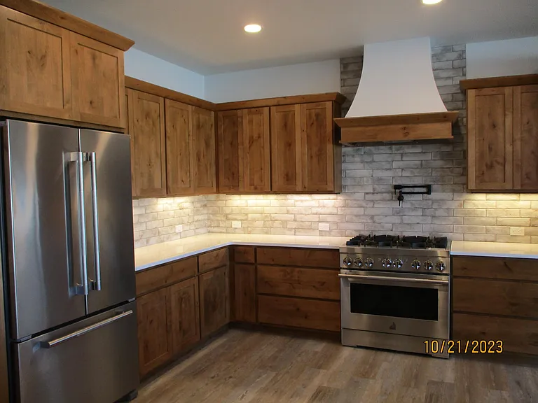 Kitchen features Jenn Air appliances; 6-burner gas stove with pot filler, plenty of storage