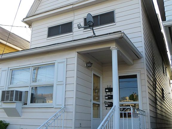 Front of building; door on left is to this 1st floor rental