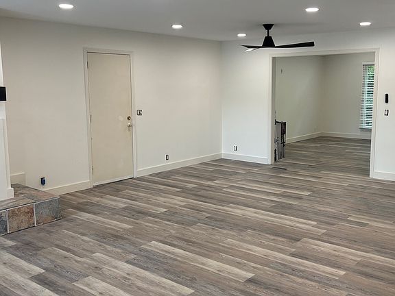 Main living room w/fireplace and view of lake - connects to garage