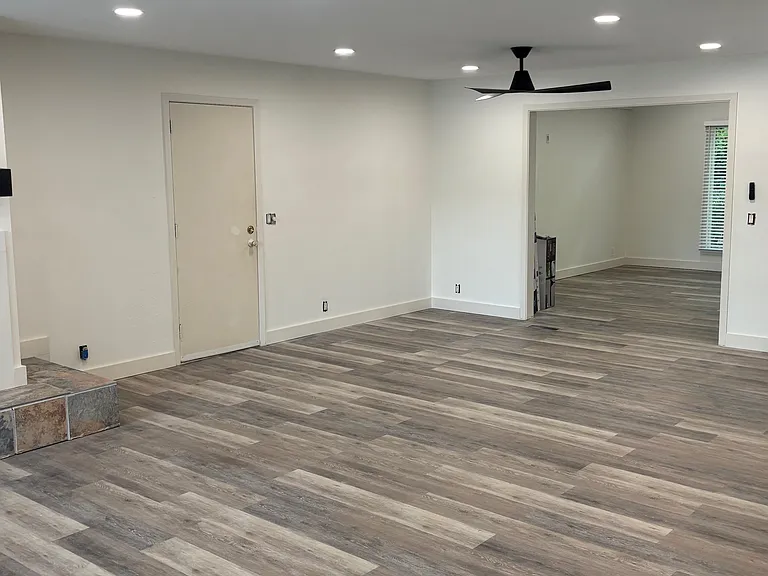 Main living room w/fireplace and view of lake - connects to garage