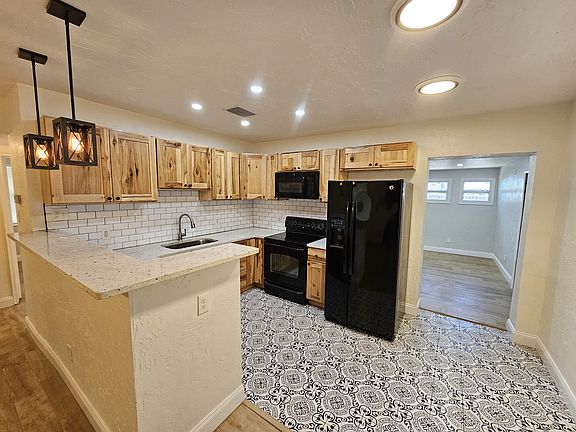 Kitchen and eat-in bar top.