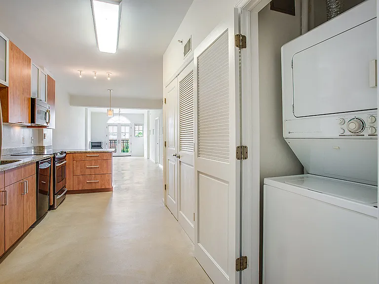 In-unit laundry by the kitchen