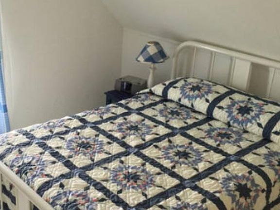 This is the middle bedroom with full sized bedroom furniture