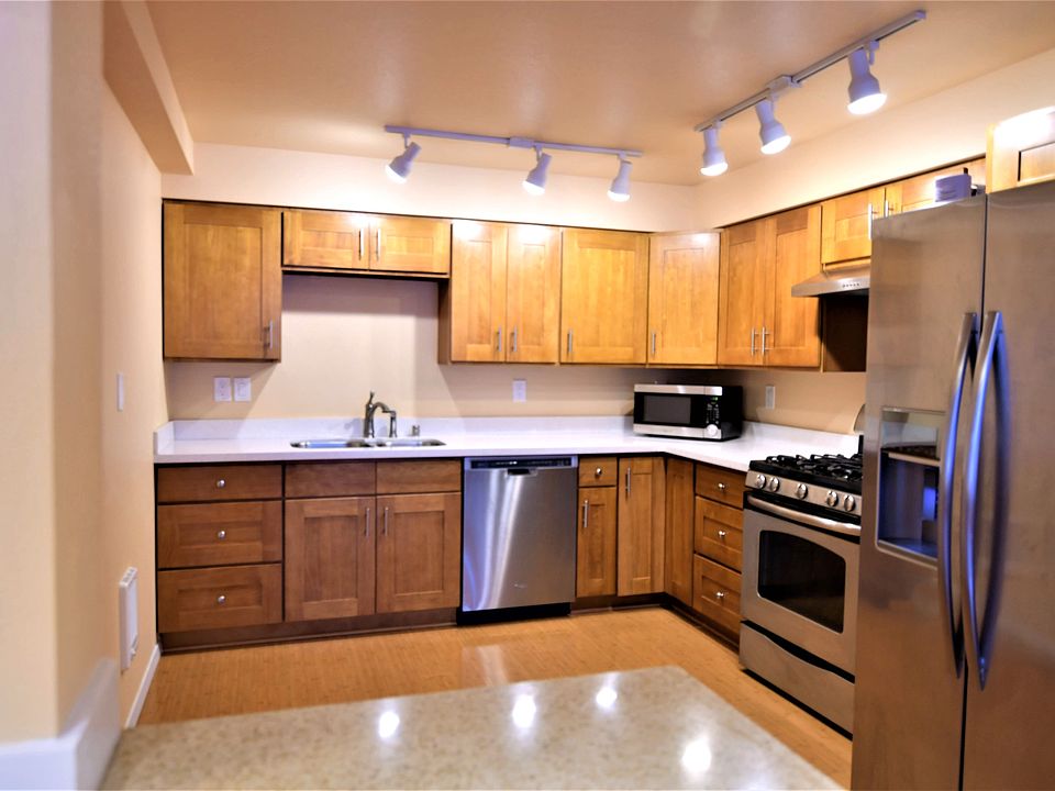 Kitchen. Quartz counter tops, maple cabinets.
Stainless steel appliances, gas stove and oven and full size refrigerator/freezer