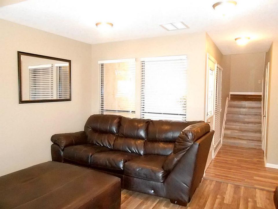 Part of living room. Has high ceilings and a fireplace.