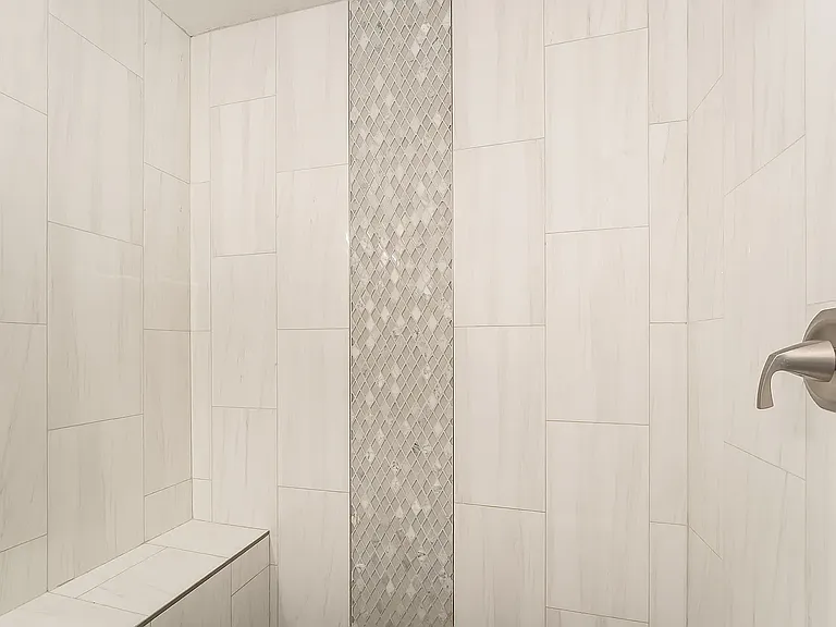 Primary Suite Shower with Large Bench and designer tiles