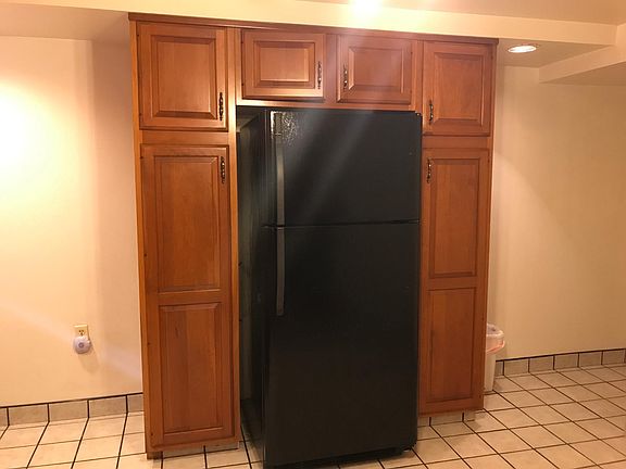Refrigerator and spacious cabinetry in Eat-in Kitchen