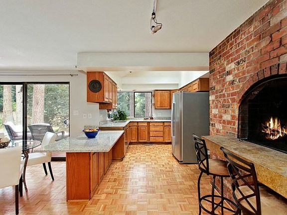 Updated kitchen with granite counters and stainless steel applia