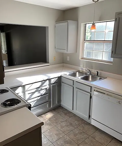 Kitchen with dishwasher and food disposal