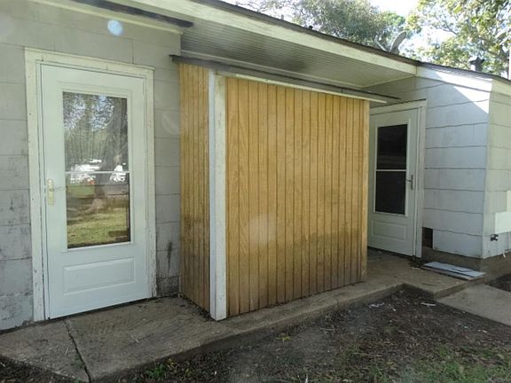 Storm doors recently added and all wood replaced on shed.
