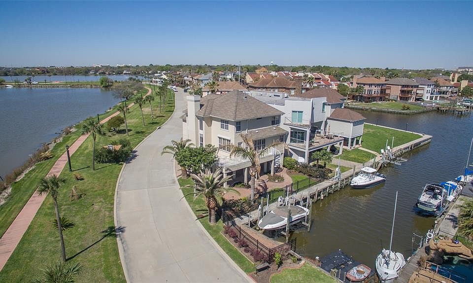 COME SEE THIS BEAUTIFULLY MAINTAINED HOME IN POPULAR NASSAU BAY WITH OVER 1,000 SQ FT OF OUTDOOR LIVING AREA. DOCK YOUR BOAT AT YOUR BACK DOOR AND YOU'RE IN CLEAR LAKE AND GALVESTON BAY IN MINUTES! THIS HOME IS MOVE-IN READY WITH FRESH CARPET THROUGH