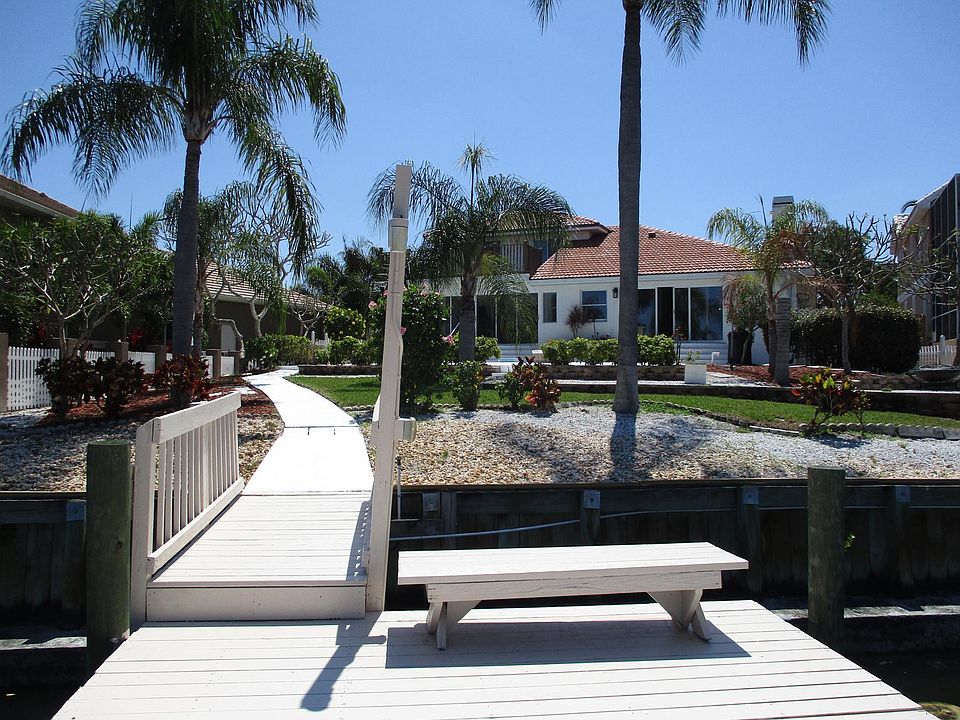 Backyard from Our Dock - You Get Beautiful View of Canal and Pool from the Large Back Windows