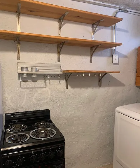 Kitchen (includes refrigerator/freezer, oven/stove, dishwasher, and washer/dryer)