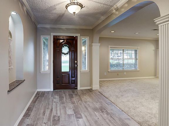 Entering the front door - this home has new carpet, new paint, and new tile/wood flooring throughout.