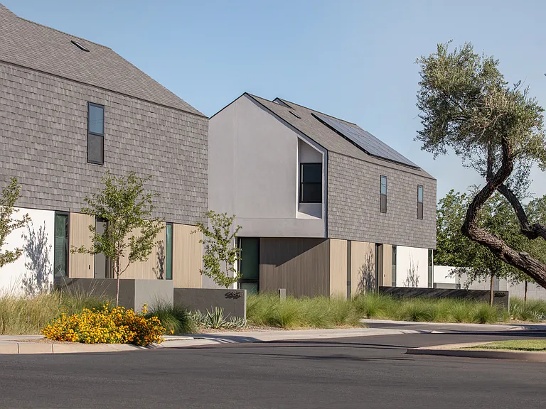 Modern architecture softened by mature desert landscaping creates a refined residential setting between North Central Phoenix, the Biltmore, and Arcadia.
