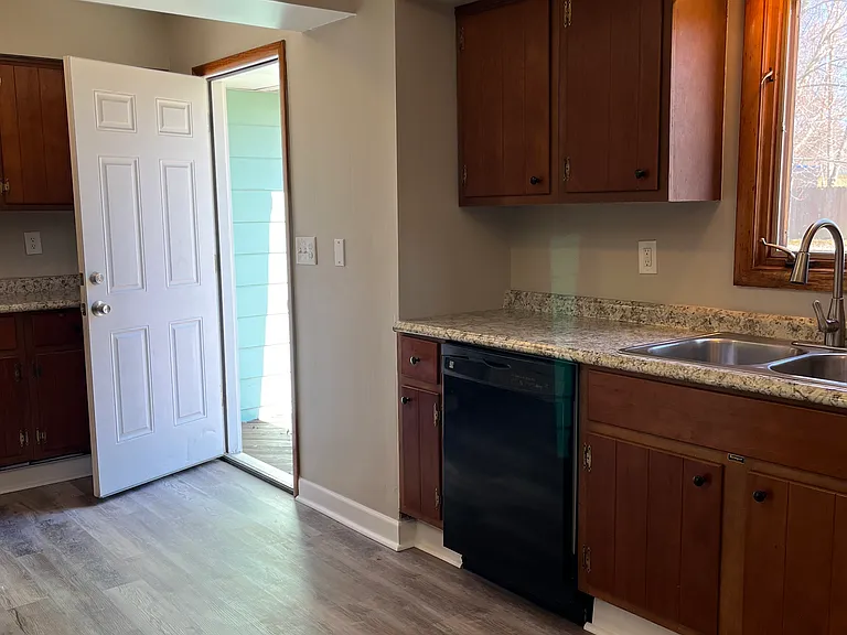 Kitchen with deck door open
