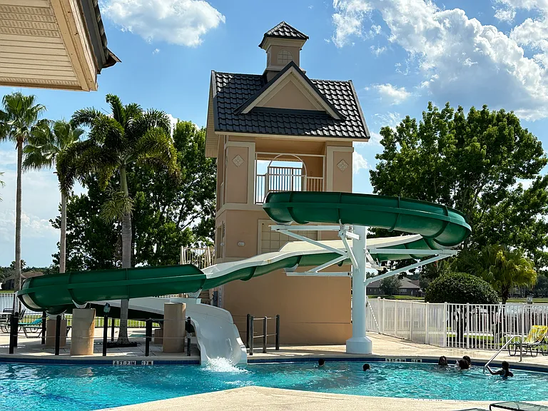 Community adult and kiddy pools equipped with a fun water slide!