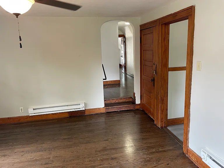 Livingroom leading into raised hallway