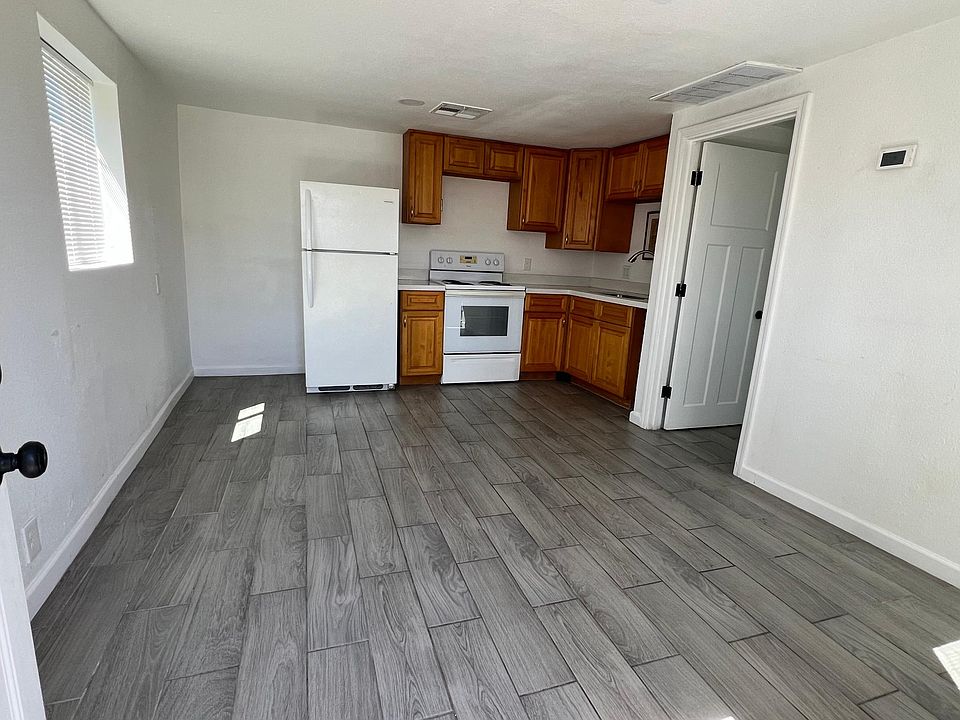 As you walk in through the front door, Living area and kitchen