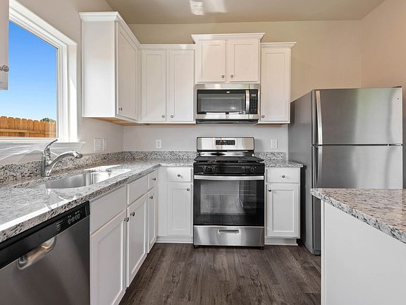 This home includes a chef-ready kitchen with granite counters, stainless appliances!