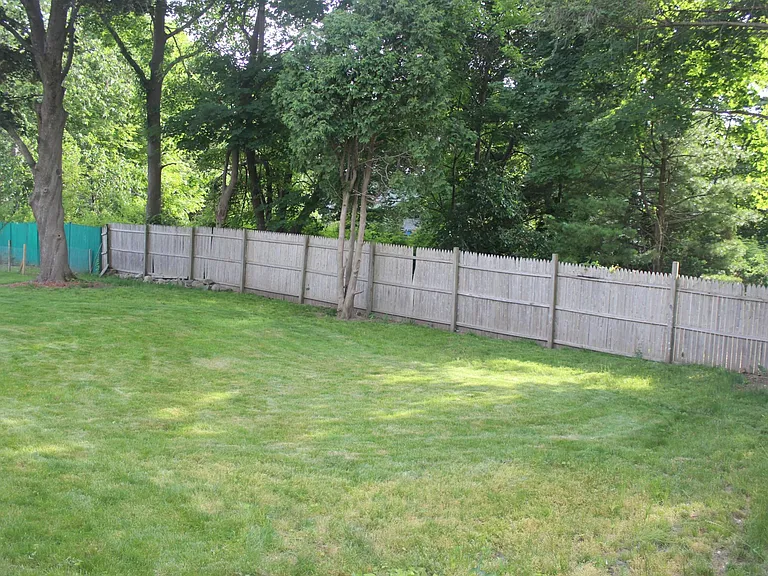 2 side fenced backyard