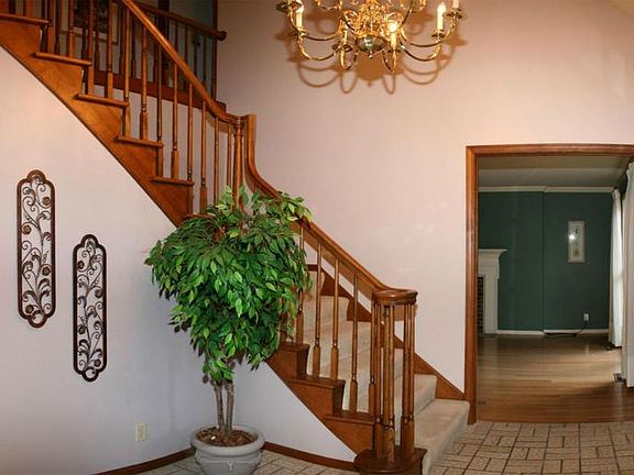 Beautiful stairway and vaulted foyer greets you as you enter the home.
