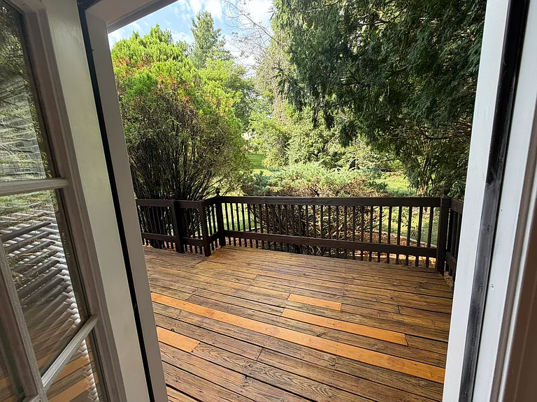 Kitchen door opens to back deck... awaiting your BBQ grill.