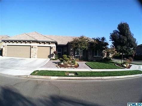 Front of home on large corner lot. Home backs up to gated community.