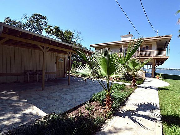 Outside of the two car garage is an additional covered patio.