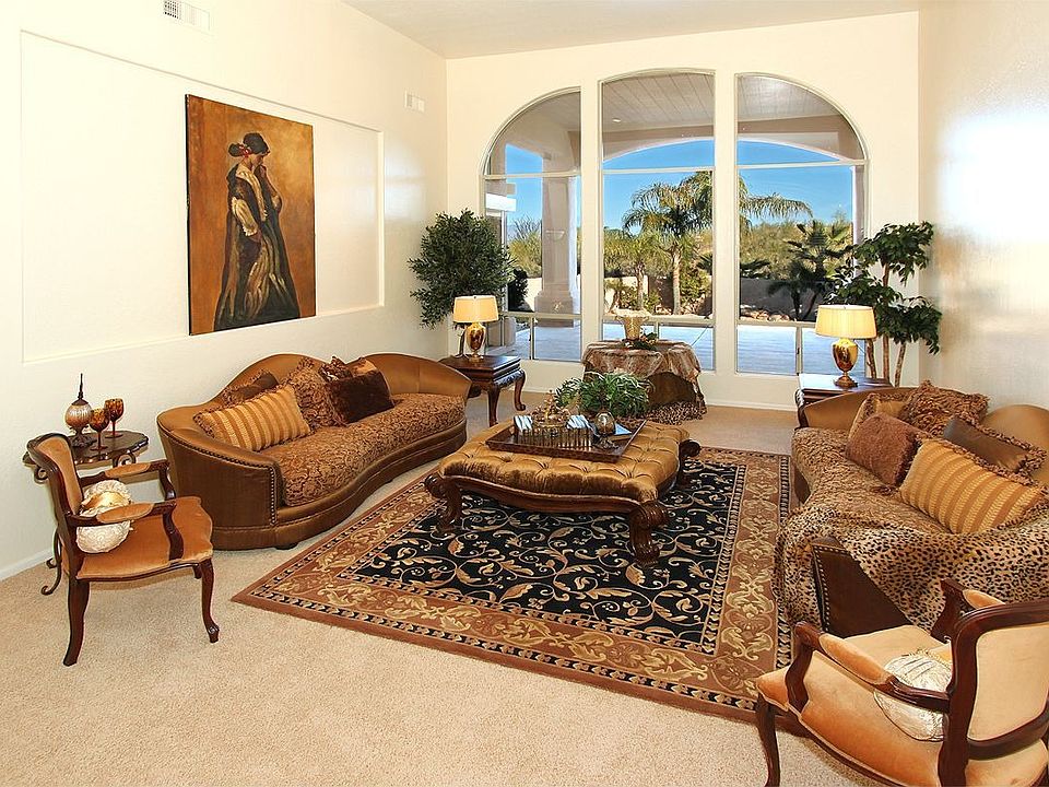 The large living room has floor to ceiling windows to let in beautiful views!