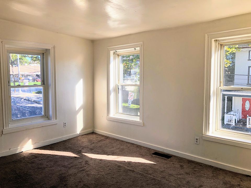 Front bedroom view from living room. Very bright natural light. Has a closet not shown in pic.