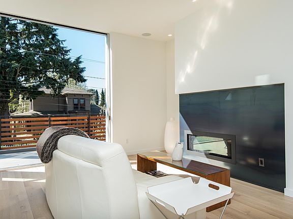 Gas fireplace, floor to ceiling "pocket" door out to front p