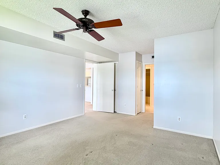 Spacious bedroom w/ HUGE walk-in closet + a linen and storage closet!