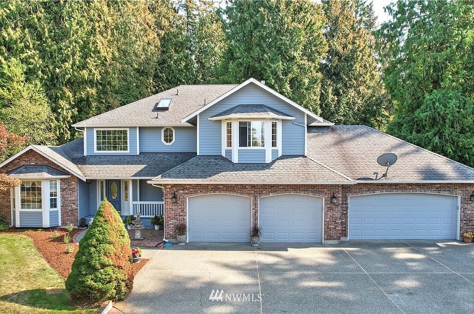 Prepare to fall in love as soon as you arrive to this gorgeous home on acreage! Built with a four-car garage, it is tucked away from neighbors ~ surrounded by tranquility on over 4 acres of land!