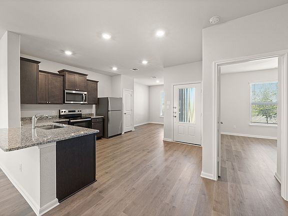 The kitchen and dining room sit right next to each other.