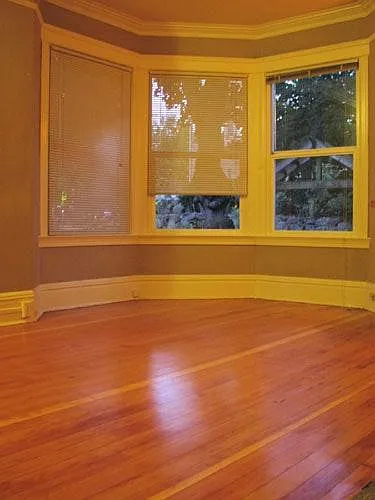 living room with bay window and hardwood floors