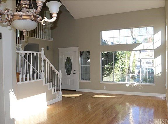 Beautiful Formal Living Room with hard wood floors and lots of natural light. Upgraded front door too.
