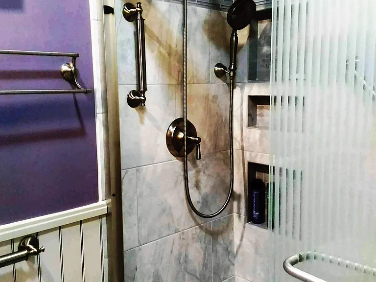 master bathroom Kohler fixed and hand shower heads, grab bars, custom niches
