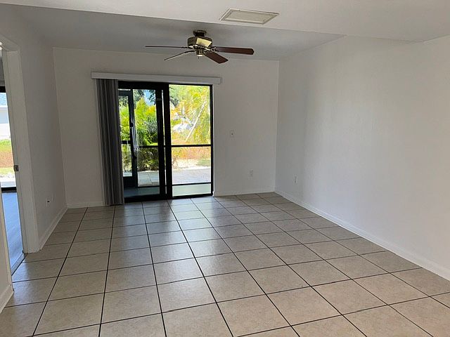 Living room , impact patio door to screened lanai with patio access.