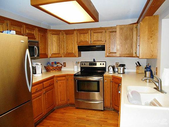 Attractive wood cabinets, solid surface counter tops