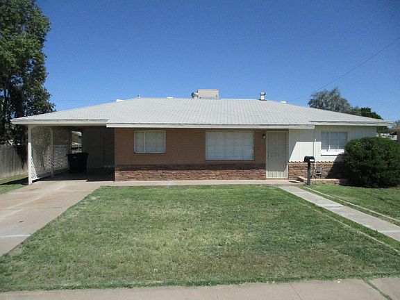 Front view with carport