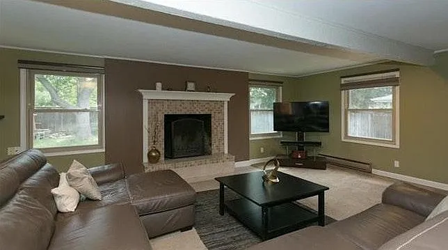 large newer family room with fireplace