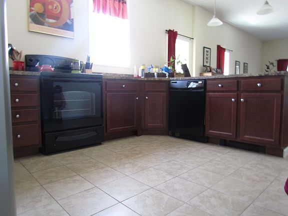 kitchen C shaped w/ Stainless steel refridgerator