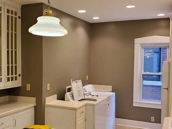 Kitchen is large and expands across the rear of this home. Center island with gas range and your washer & dryer is here.