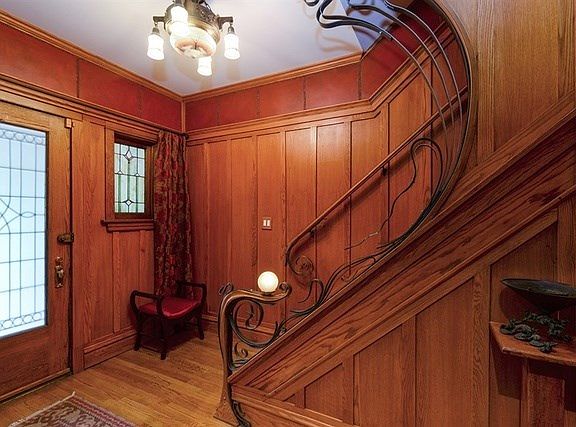 Quarter sawn oak walls, cold bent steel around hand carved newel post