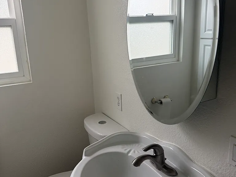 Standing sink and medicine cabinet in bathroom #1