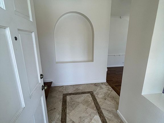 Entry hall with Travertine floor.